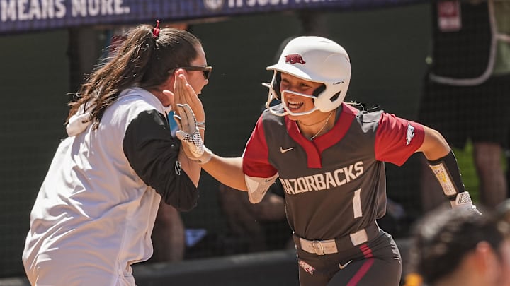 May 8, 2025; Athens, GA, USA; Arkansas utility Raigan Kramer (1) reacts with teammates after hitting a grand slam home run against Tennessee at Jack Turner Stadium. Mandatory Credit: Dale Zanine-Imagn Images