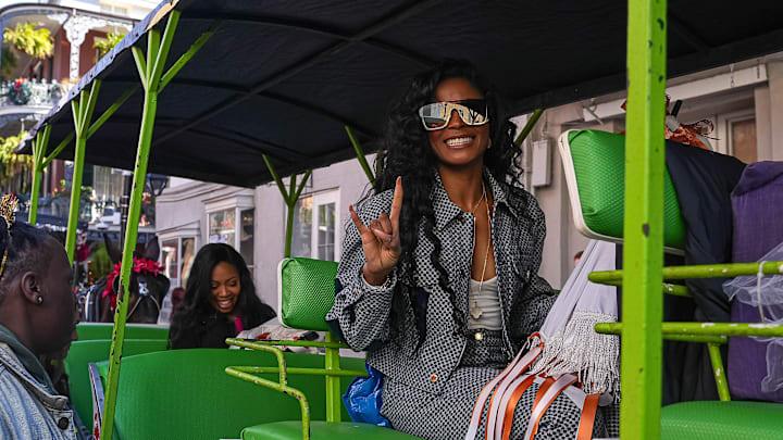 Loreal Sarkisian, wife of Texas Longhorns head coach Steve Sarkisian, holds up "Hook 'Em Horns" during the Sugar Bowl