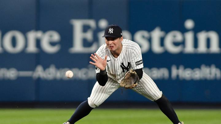 Jun 16, 2026; Bronx, New York, USA; New York Yankees shortstop Anthony Volpe (11) fields a ground ball hit by Chicago White Sox center fielder Luisangel Acuña (not pictured) and throws to first base for an out during the ninth inning at Yankee Stadium. Mandatory Credit: John Jones-Imagn Images
