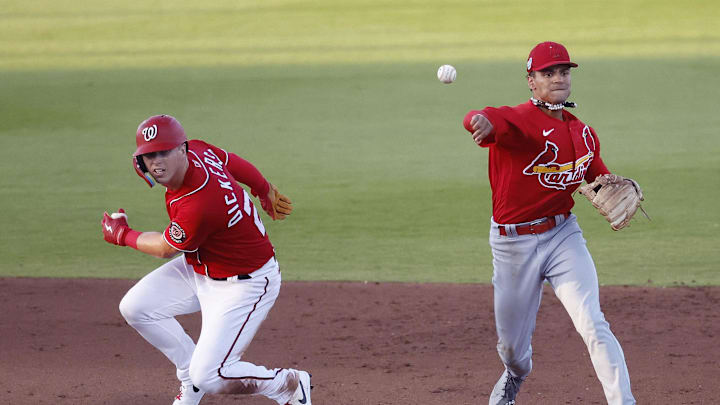 Mar 24, 2023; West Palm Beach, Florida, USA; Washington Nationals left fielder Corey Dickerson (23) is out at second as St. Louis Cardinals short stop Masyn Wynn (80) throws to first to complete the double play during the fourth inning at The Ballpark of the Palm Beaches. 