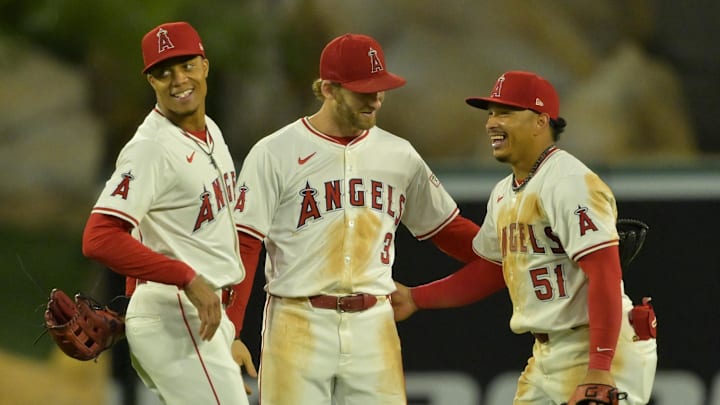 Sep 17, 2024; Anaheim, California, USA;  Los Angeles Angels center fielder Jordyn Adams (39), left fielder Taylor Ward (3) and right fielder Gustavo Campero (51) smile as they come off the field after the final out of the ninth inning against the Chicago White Sox at Angel Stadium. Mandatory Credit: Jayne Kamin-Oncea-Imagn Images