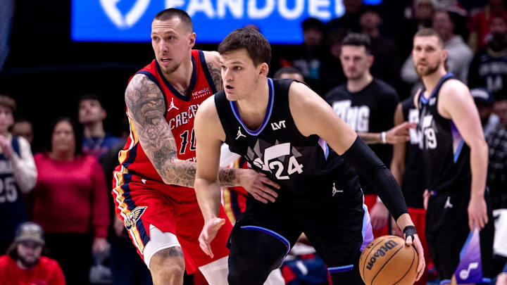 Jan 20, 2025; New Orleans, Louisiana, USA;  Utah Jazz center Walker Kessler (24) dribbles against New Orleans Pelicans center Daniel Theis (10) during the first half at Smoothie King Center. Mandatory Credit: Stephen Lew-Imagn Images