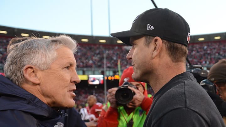 December 8, 2013; San Francisco, CA, USA; Seattle Seahawks head coach Pete Carroll (left) shakes hands with San Francisco 49ers head coach Jim Harbaugh (right) after the game at Candlestick Park. The 49ers defeated the Seahawks 19-17. Mandatory Credit: Kyle Terada-Imagn Images