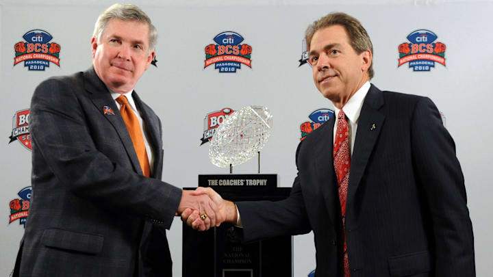 Jan 6, 2010, Newport Beach, CA, USA; Texas Longhorns coach Mack Brown (left) and Alabama Crimson Tide coach Nick Saban pose with the Coaches Trophy at a press conference for the 2010 BCS National Championship.
