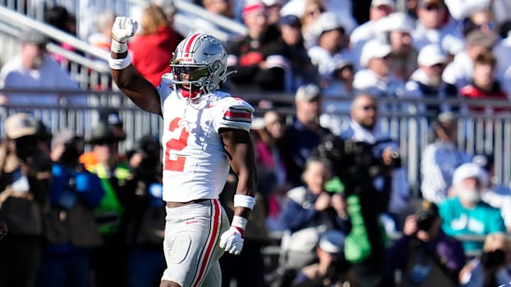 Ohio State Buckeyes safety Caleb Downs (2) celebrates a tackle of Penn State Nittany Lions tight end Tyler Warren (44) during the second half of the NCAA football game at Beaver Stadium in University Park, Pa. on Saturday, Nov. 2, 2024. Ohio State won 20-13.