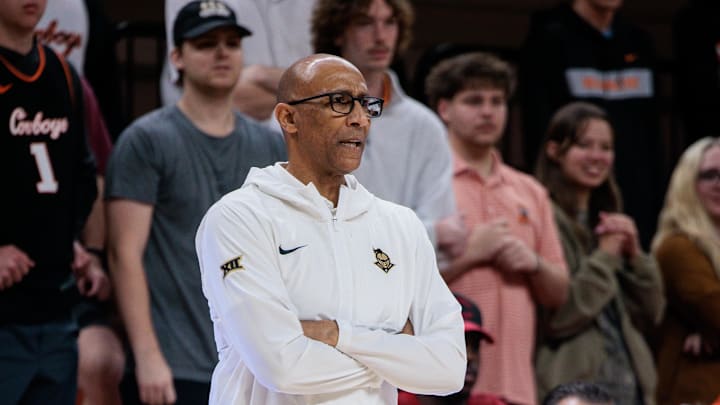 Jan 6, 2026; Stillwater, Oklahoma, USA; UCF Knights coach Johnny Dawkins watches game play during the first half against the Oklahoma State Cowboys at Gallagher-Iba Arena. Mandatory Credit: William Purnell-Imagn Images