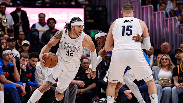 May 15, 2025; Denver, Colorado, USA; Denver Nuggets forward Aaron Gordon (32) controls the ball as center Nikola Jokic (15) screens against Oklahoma City Thunder guard Shai Gilgeous-Alexander (2) in the second quarter during game six of the second round for the 2025 NBA Playoffs at Ball Arena. Mandatory Credit: Isaiah J. Downing-Imagn Images