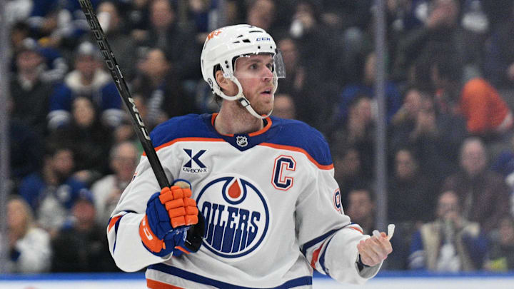 Nov 16, 2024; Toronto, Ontario, CAN;  Edmonton Oilers forward Connor McDavid (97) reacts after being called for a minor penalty against the Toronto Maple Leafs in the second period at Scotiabank Arena. Mandatory Credit: Dan Hamilton-Imagn Images