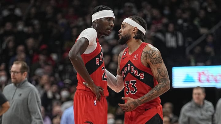 Nov 23, 2022; Toronto, Ontario, CAN; Toronto Raptors guard Gary Trent Jr. (33) talks to forward Chris Boucher (25) during a break in the action against the Brooklyn Nets during the second quarter at Scotiabank Arena. Mandatory Credit: John E. Sokolowski-USA TODAY Sports