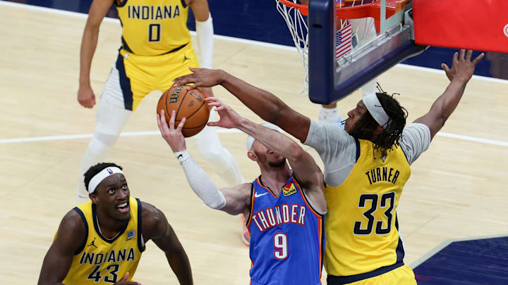 Jun 19, 2025; Indianapolis, Indiana, USA; Indiana Pacers center Myles Turner (33) blocks a shot by Oklahoma City Thunder guard Alex Caruso (9) in the third quarter during game six of the 2025 NBA Finals at Gainbridge Fieldhouse. Mandatory Credit: Trevor Ruszkowski-Imagn Images