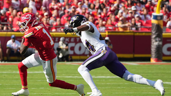 Sep 28, 2025; Kansas City, Missouri, USA; Kansas City Chiefs wide receiver Xavier Worthy (1) runs after making na catch as Baltimore Ravens cornerback Marlon Humphrey (44) defends at GEHA Field at Arrowhead Stadium. Mandatory Credit: Denny Medley-Imagn Images