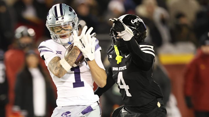 Nov 30, 2024; Ames, Iowa, USA; Kansas State Wildcats wide receiver Jayce Brown (1) catches a pass in front of Iowa State Cyclones defensive back Jeremiah Cooper (4) in the second quarter at at Jack Trice Stadium. Mandatory Credit: Reese Strickland-Imagn Images Nov 30, 2024; Ames, Iowa, USA; Kansas State Wildcats wide receiver Jayce Brown (1) catches a pass in front of Iowa State Cyclones defensive back Jeremiah Cooper (4) in the second quarter at at Jack Trice Stadium. Mandatory Credit: Reese Strickland-Imagn Images