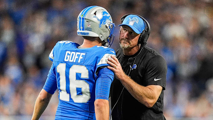Detroit Lions quarterback Jared Goff (16) talks to head coach Dan Campbell at a timeout against Los Angeles Rams during the first half at Ford Field in Detroit on Sunday, September 8, 2024.
