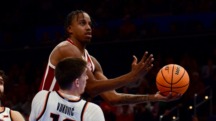 Oklahoma forward Derrion Reid attempts a layup against Oklahoma State. Oklahoma forward Derrion Reid attempts a layup against Oklahoma State.