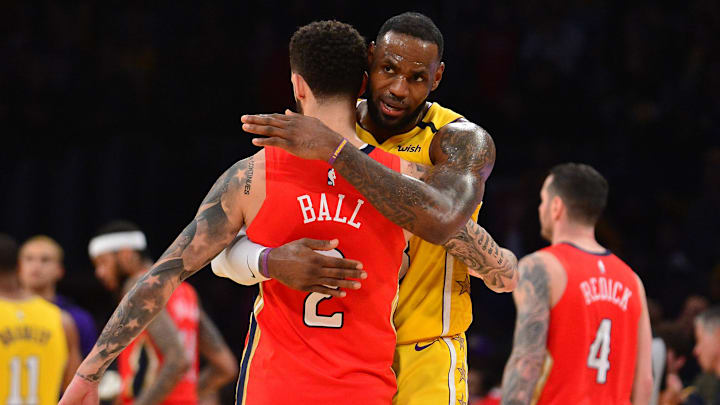 January 3, 2020; Los Angeles, California, USA; Los Angeles Lakers forward LeBron James (23) meets with New Orleans Pelicans guard Lonzo Ball (2) following the 123-113 victory at Staples Center. Mandatory Credit: Gary A. Vasquez-Imagn Images