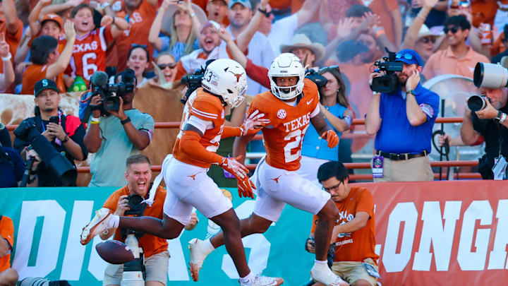 Texas Longhorns defensive back Ryan Niblett reacts after returning a punt for a touchdown during the second half against the Oklahoma Sooners at the Cotton Bowl.