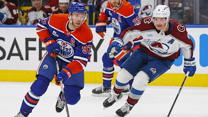 Nov 8, 2025; Edmonton, Alberta, CAN; Edmonton Oilers forward Connor McDavid (97) looks to make a play in front of Colorado Avalanche defensemen Cale Makar (8) during the third period at Rogers Place. Mandatory Credit: Perry Nelson-Imagn Images