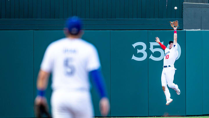 Oklahoma City Dodgers outfielder Ryan Ward (10) jumps up to catch a ball headed over the fence during a Minor League Baseball game between the Oklahoma City Dodgers and the Las Vegas Aviators at Chickasaw Bricktown Ballpark in Oklahoma City on Wednesday, June 21, 2023.