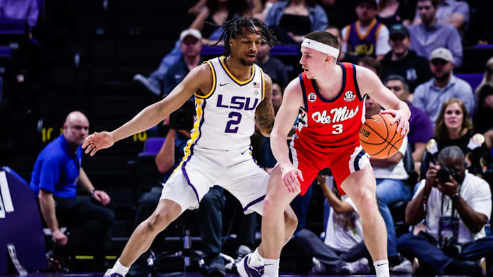 Feb 8, 2025; Baton Rouge, Louisiana, USA; Mississippi Rebels guard Sean Pedulla (3) dribbles against LSU Tigers guard Mike Williams III (2) during the first half at Pete Maravich Assembly Center. Mandatory Credit: Stephen Lew-Imagn Images
