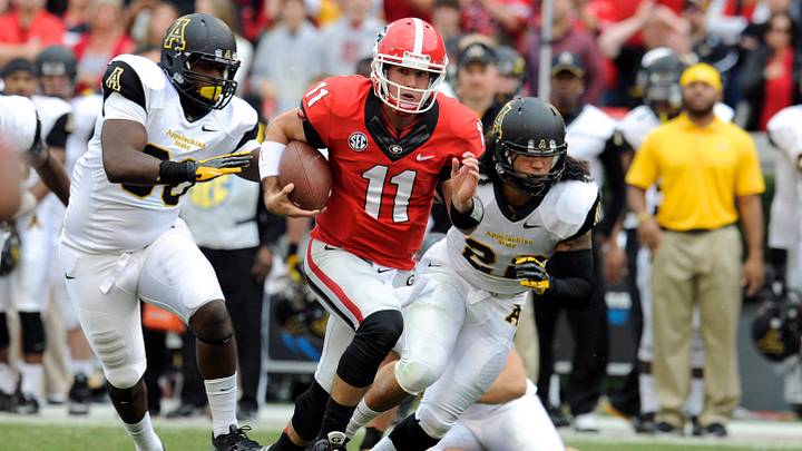 Nov 9, 2013; Athens, GA, USA; Georgia Bulldogs quarterback Aaron Murray (11) runs through the Appalachian State Mountaineers defense during the second half at Sanford Stadium. Georgia defeated Appalachian State 45-6. Mandatory Credit: Dale Zanine-Imagn Images