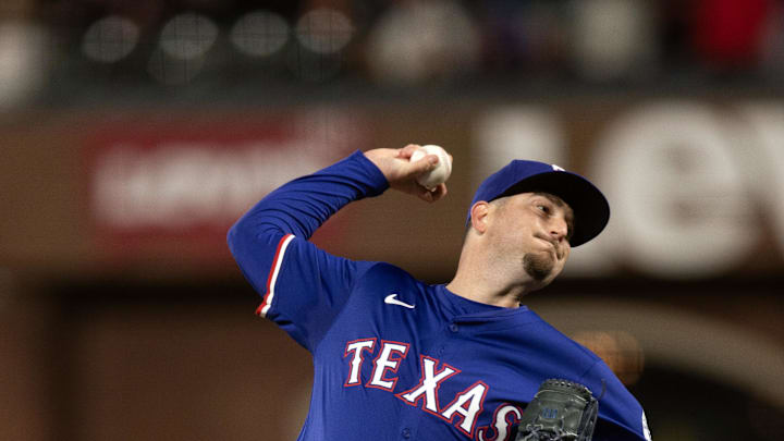 Apr 25, 2025; San Francisco, California, USA; Texas Rangers pitcher Luke Jackson (77) delivers a pitch against the San Francisco Giants during the ninth inning at Oracle Park. 