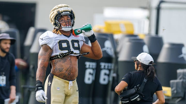 Jul 30, 2025; New Orleans, LA, USA;  New Orleans Saints defensive end Chase Young (99) cools down on a break during training camp at Ochsner Sports Performance Center. Mandatory Credit: Stephen Lew-Imagn Images
