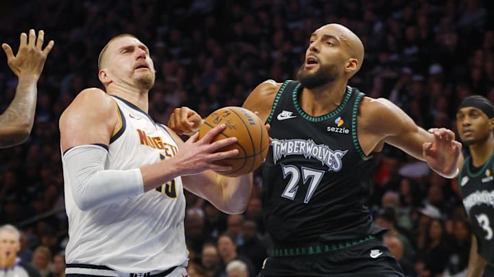 Apr 23, 2026; Minneapolis, Minnesota, USA; Denver Nuggets center Nikola Jokic (15) goes to the basket against Minnesota Timberwolves center Rudy Gobert (27) in the third quarter at Target Center. Mandatory Credit: Bruce Kluckhohn-Imagn Images