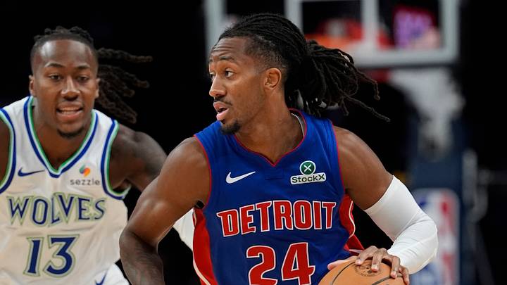 Oct 14, 2026; Minneapolis, Minnesota, USA;  Detroit Pistons guard Daniss Jenkins (24) brings the ball up past Minnesota Timberwolves guard Ayo Dosunmu (13) in the first quarter at Target Center.  Mandatory Credit: Bruce Kluckhohn-Imagn Images