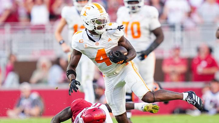 Tennessee wide receiver Mike Matthews (4) runs with the ball during a college football game between Tennessee and Arkansas at Donald W. Reynolds Razorback Stadium in Fayetteville, Ark., on Oct. 10, 2026. Tennessee wide receiver Mike Matthews (4) runs with the ball during a college football game between Tennessee and Arkansas at Donald W. Reynolds Razorback Stadium in Fayetteville, Ark., on Oct. 10, 2026.