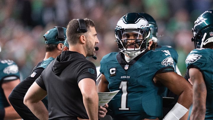 Sep 16, 2024; Philadelphia, Pennsylvania, USA; Philadelphia Eagles quarterback Jalen Hurts (1) talks with head coach Nick Sirianni during a timeout in the first quarter against the Atlanta Falcons at Lincoln Financial Field. Mandatory Credit: Bill Streicher-Imagn Images