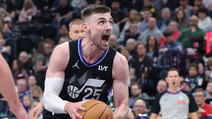 Mar 21, 2025; Salt Lake City, Utah, USA; Utah Jazz center Micah Potter goes to the basket against the Boston Celtics during the second half at Delta Center. Mandatory Credit: Rob Gray-Imagn Images
