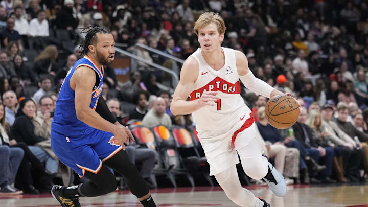 Toronto Raptors guard Gradey Dick drives to the net past New York Knicks guard Jalen Brunson.