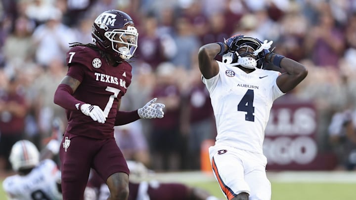 Sep 27, 2025; College Station, Texas, USA; Auburn Tigers wide receiver Malcolm Simmons (4) reacts as Texas A&M Aggies cornerback Tyreek Chappell (7) defends during the fourth quarter at Kyle Field. Mandatory Credit: Troy Taormina-Imagn Images