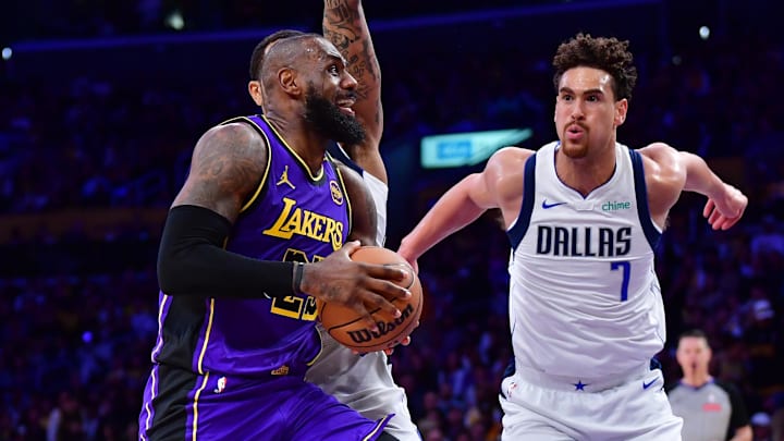 Feb 25, 2025; Los Angeles, California, USA; Los Angeles Lakers forward LeBron James (23) goes into shot the ball on Dallas Mavericks center Dwight Powell (7) during the second half at Crypto.com Arena. Mandatory Credit: Gary A. Vasquez-Imagn Images Feb 25, 2025; Los Angeles, California, USA; Los Angeles Lakers forward LeBron James (23) goes into shot the ball on Dallas Mavericks center Dwight Powell (7) during the second half at Crypto.com Arena. Mandatory Credit: Gary A. Vasquez-Imagn Images