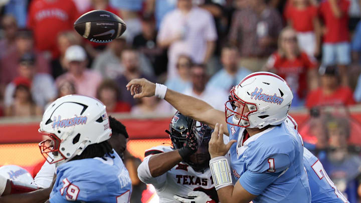 Houston Cougars quarterback Conner Weigman (1) completes a pass against the Texas Tech Raiders in the first half at TDECU Stadium. Houston Cougars quarterback Conner Weigman (1) completes a pass against the Texas Tech Raiders in the first half at TDECU Stadium.