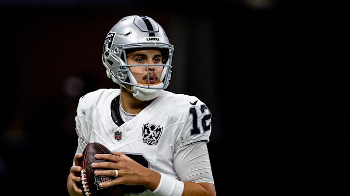Dec 29, 2024; New Orleans, Louisiana, USA;  Las Vegas Raiders quarterback Aidan O'Connell (12) drops back to pass against the New Orleans Saints during the first half at Caesars Superdome. Mandatory Credit: Stephen Lew-Imagn Images