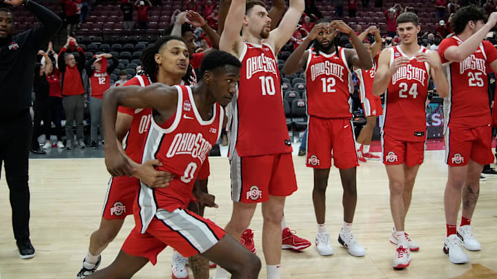 Mar 3, 2024; Columbus, OH, USA; Ohio State Buckeyes forward Devin Royal (21) holds back Ohio State