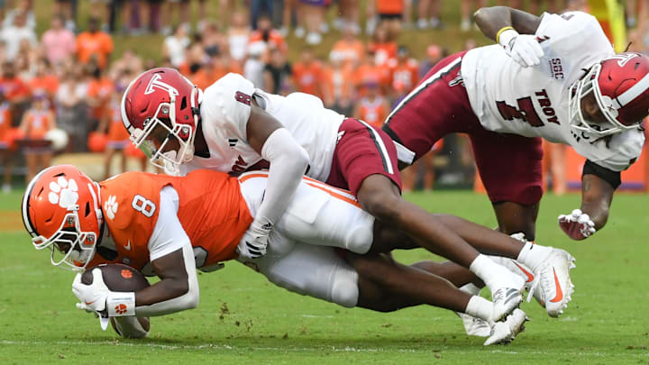 Troy Trojans cornerback Jaquez White (8) tackles Clemson Tigers running back Adam Randall (8) Saturday, Sept. 6, 2025 during the NCAA football game at Memorial Stadium in Clemson, South Carolina.