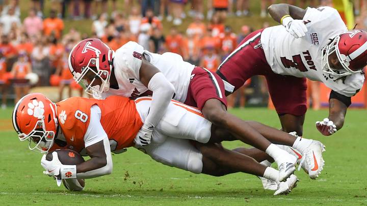 Troy cornerback Jaquez White (8) tackles Clemson running back Adam Randall (8) on Sept. 6, 2025, at Memorial Stadium in Clemson, S.C. Troy cornerback Jaquez White (8) tackles Clemson running back Adam Randall (8) on Sept. 6, 2025, at Memorial Stadium in Clemson, S.C.