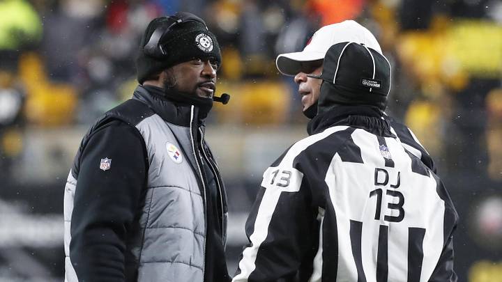 Dec 24, 2022; Pittsburgh, Pennsylvania, USA;  Pittsburgh Steelers head coach Mike Tomlin (left) talks with referee Tra Blake (middle) and down judge Patrick Turner (13) against the Las Vegas Raiders during the fourth quarter at Acrisure Stadium. The Steelers won 13-10. Mandatory Credit: Charles LeClaire-Imagn Images