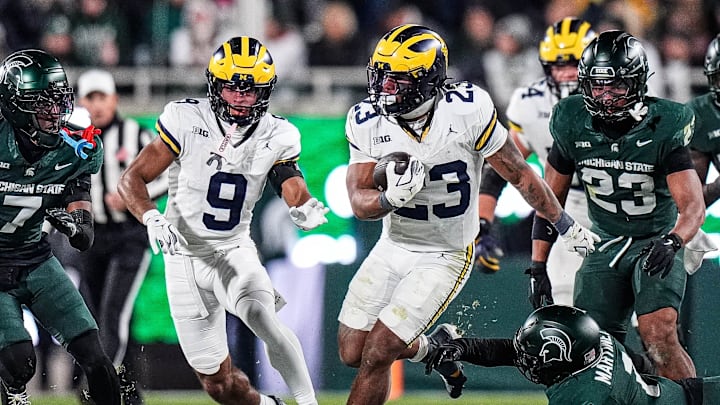 Michigan running back Jordan Marshall (23) runs against Michigan State during the second half at Spartan Stadium in East Lansing on Saturday, October 25, 2025. Michigan running back Jordan Marshall (23) runs against Michigan State during the second half at Spartan Stadium in East Lansing on Saturday, October 25, 2025.