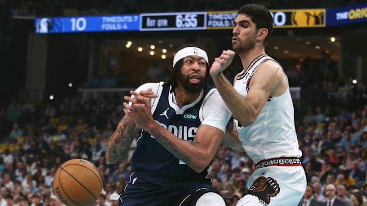 Apr 18, 2025; Memphis, Tennessee, USA; Dallas Mavericks forward Anthony Davis (3) drives to the basket against Memphis Grizzlies forward Santi Aldama (7) during the first quarter at FedExForum. Mandatory Credit: Petre Thomas-Imagn Images