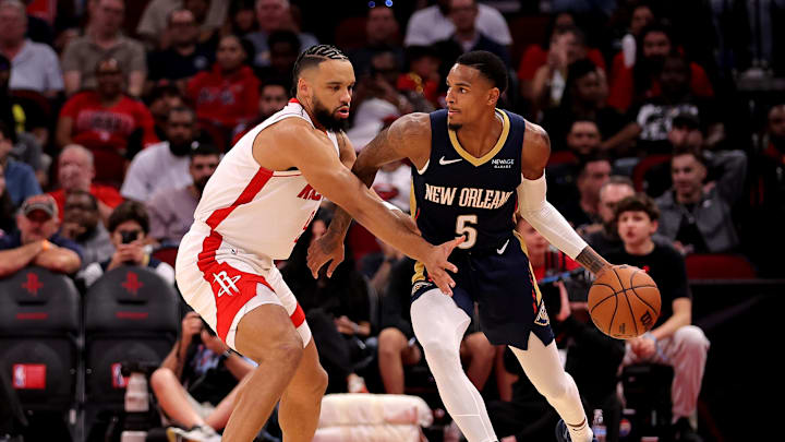 Oct 15, 2024; Houston, Texas, USA; New Orleans Pelicans guard Dejounte Murray (5) handles the ball against Houston Rockets forward Dillon Brooks (9) during the third quarter at Toyota Center. Mandatory Credit: Erik Williams-Imagn Images
