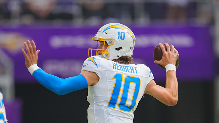 Sep 24, 2023; Minneapolis, Minnesota, USA; Los Angeles Chargers quarterback Justin Herbert (10) throws against the Minnesota Vikings in the first quarter at U.S. Bank Stadium. Mandatory Credit: Brad Rempel-Imagn Images