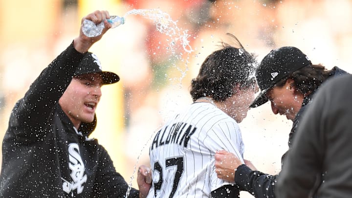 Chicago White Sox pinch hitter Brooks Baldwin (27) celebrates his walk-off single RBI with teammates during the ninth inning against the Boston Red Sox at Rate Field on April 12.