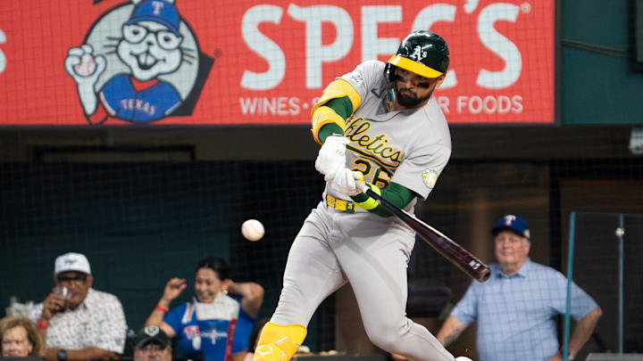 Apr 26, 2026; Arlington, Texas, USA;  Athletics left fielder Carlos Cortes (26) hits a two-run triple during the first inning against the Texas Rangers at Globe Life Field. Mandatory Credit: Raymond Carlin III-Imagn Images