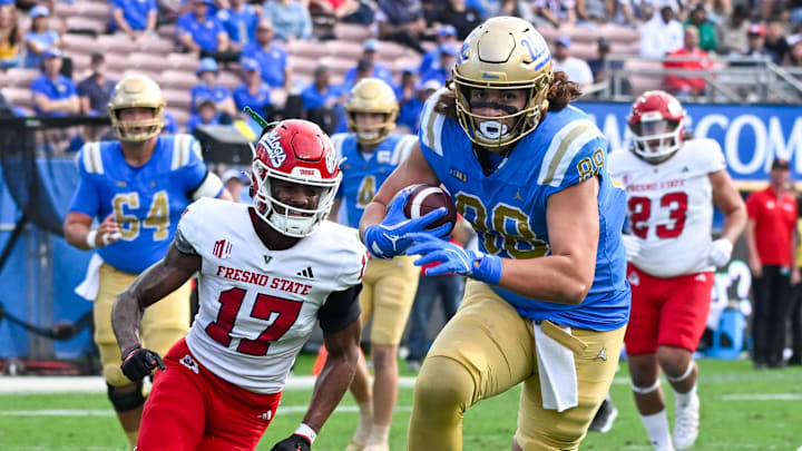 Nov 30, 2024; Pasadena, California, USA; UCLA Bruins tight end Moliki Matavao (88) Fresno State Bulldogs defensive back Jakari Embry (17) during the first quarter at Rose Bowl. Mandatory Credit: Robert Hanashiro-Imagn Images Nov 30, 2024; Pasadena, California, USA; UCLA Bruins tight end Moliki Matavao (88) Fresno State Bulldogs defensive back Jakari Embry (17) during the first quarter at Rose Bowl. Mandatory Credit: Robert Hanashiro-Imagn Images