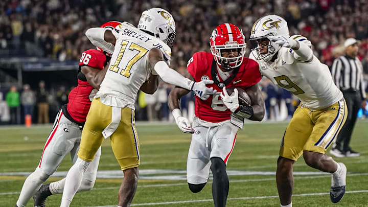Nov 25, 2023; Atlanta, Georgia, USA; Georgia Bulldogs wide receiver Dominic Lovett (6) runs against Georgia Tech Yellow Jackets defensive back Rodney Shelley (17) and defensive lineman Kyle Kennard (9) during the second half at Hyundai Field. Mandatory Credit: Dale Zanine-Imagn Images Nov 25, 2023; Atlanta, Georgia, USA; Georgia Bulldogs wide receiver Dominic Lovett (6) runs against Georgia Tech Yellow Jackets defensive back Rodney Shelley (17) and defensive lineman Kyle Kennard (9) during the second half at Hyundai Field. Mandatory Credit: Dale Zanine-Imagn Images