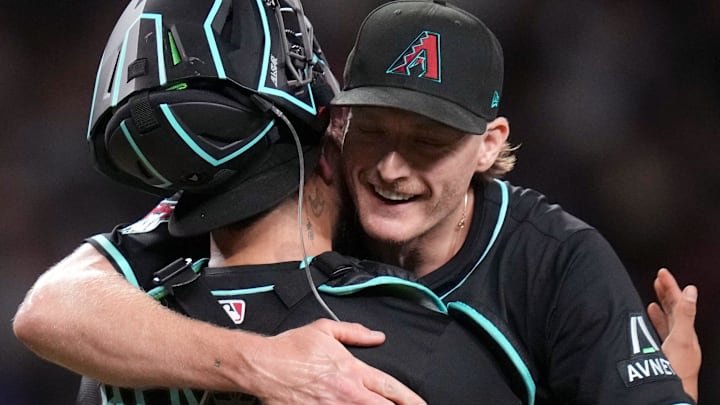 Arizona Diamondbacks right-hander Shelby Miller (18) hugs catcher Jose Herrera (11) after his save against the San Francisco Giants at Chase Field on June 30, 2025. Arizona Diamondbacks right-hander Shelby Miller (18) hugs catcher Jose Herrera (11) after his save against the San Francisco Giants at Chase Field on June 30, 2025.