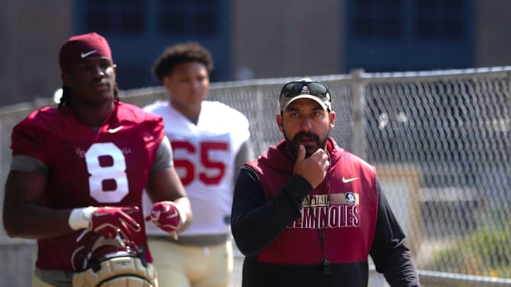 FSU football players and coaches walk into the first spring practice of the spring season on Wednesday, March 19, 2025
